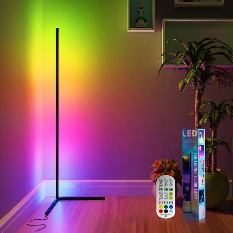 RGB corner floor lamp projecting colorful gradient light on living room walls